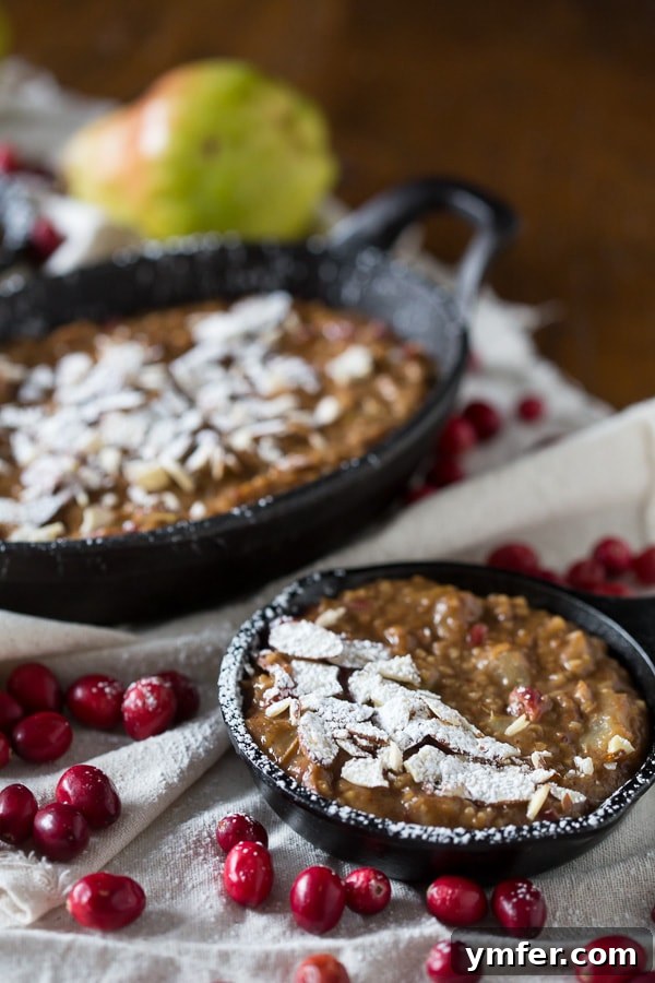 Hearty Cranberry Pear Baked Steel Cut Oats 3 Close-up of cranberry pear baked steel cut oats with fruit visible, highlighting the wholesome ingredients.