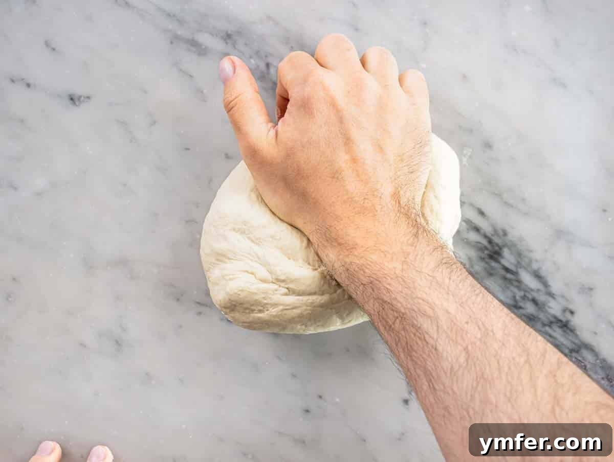 Perfect Ooni Pizza Dough Formula 11 hand kneading a pizza dough