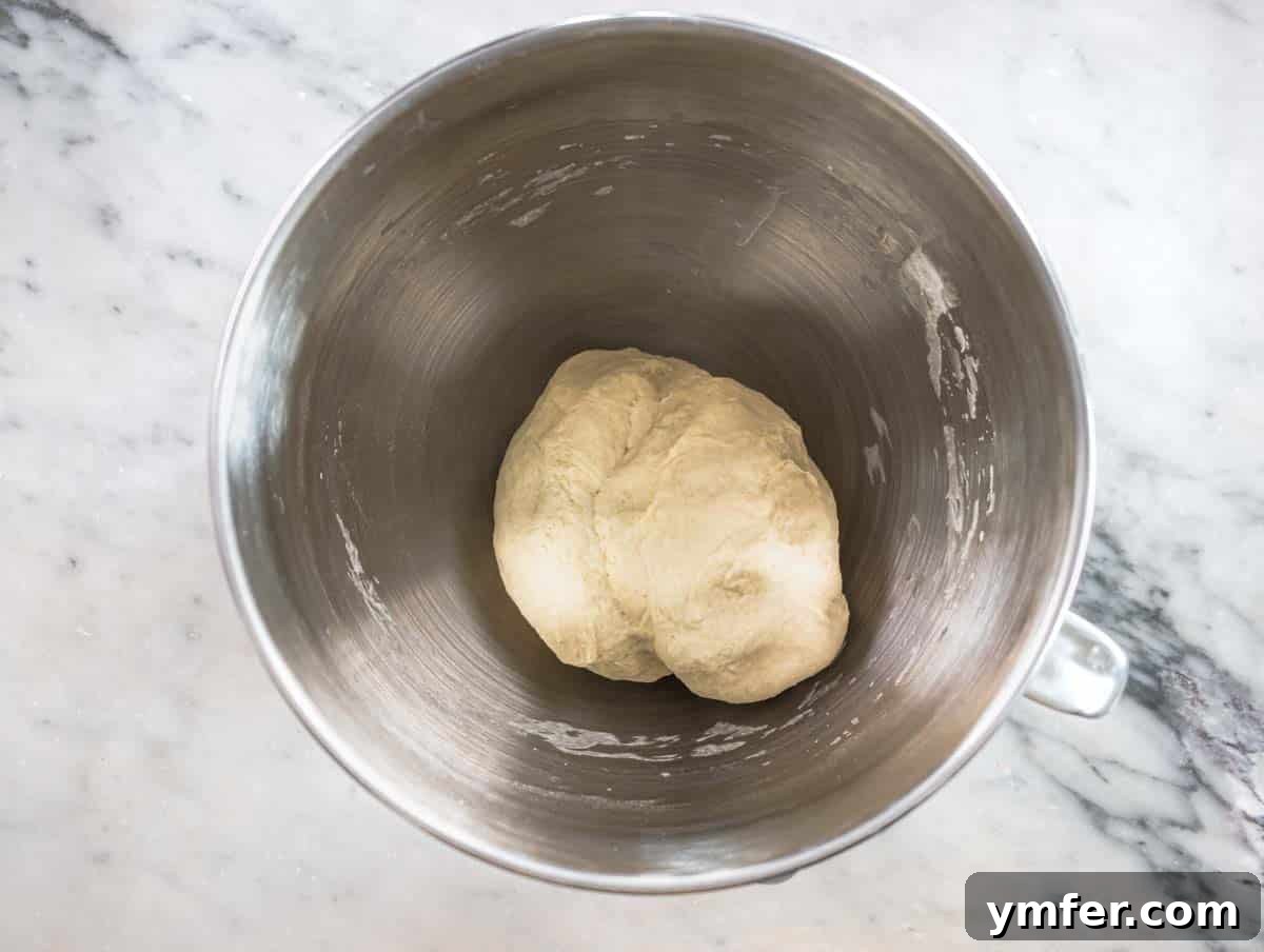 Perfect Ooni Pizza Dough Formula 13 dough in a kitchen aid bowl