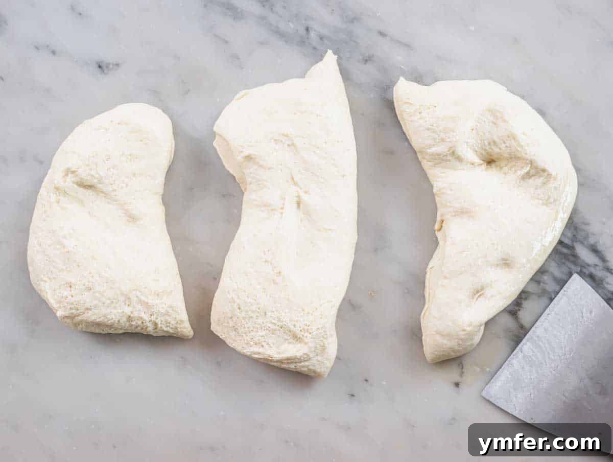 Perfect Ooni Pizza Dough Formula 22 Ooni pizza dough cut into three pieces