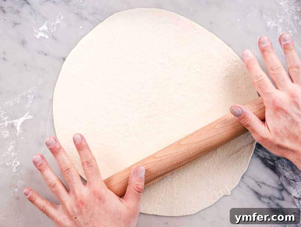 Perfect Ooni Pizza Dough Formula 41 Rolling out the Ooni pizza dough with a rolling pin