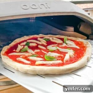 Perfect Ooni Pizza Dough Formula 43 Ooni pizza dough with toppings before baking
