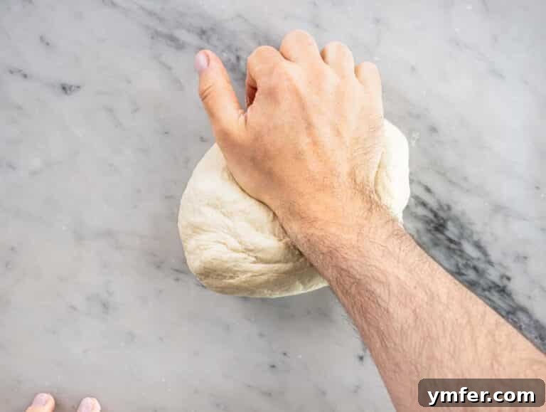 Perfect Ooni Pizza Dough Formula 46 hand kneading a pizza dough