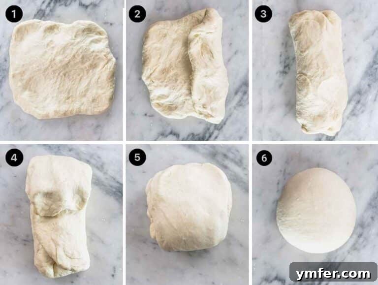 Perfect Ooni Pizza Dough Formula 47 folding the ooni pizza dough on a marble table