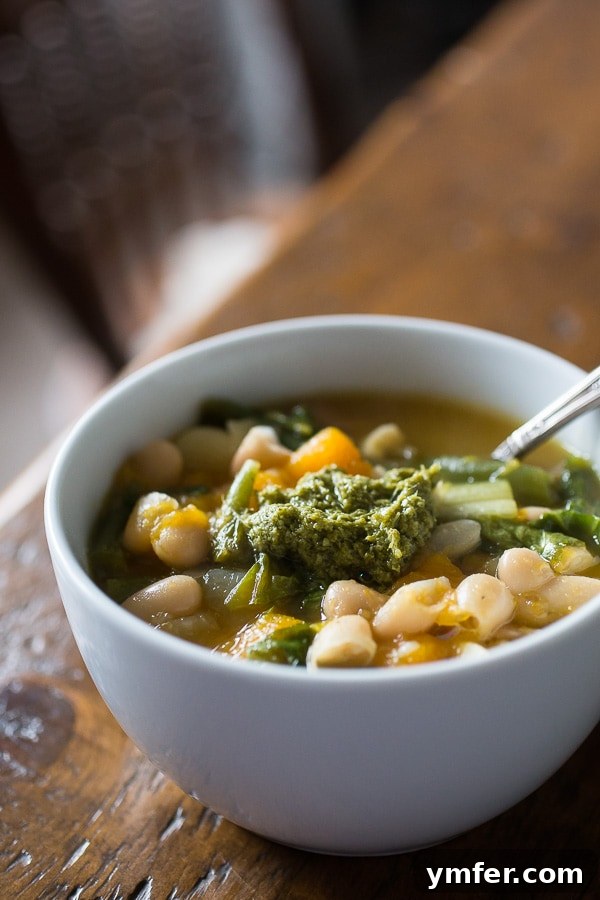 Butternut Squash Minestrone: A Quick and Hearty Winter Meal Close-up of butternut squash minestrone soup, showcasing vibrant vegetables and broth.