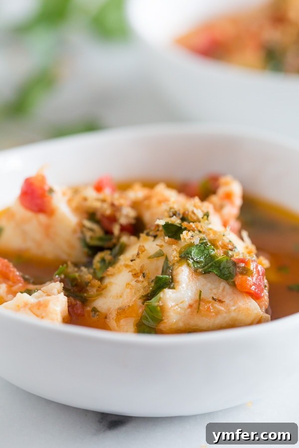 20 Minute Ocean Stew 3 Close-up of the flavorful seafood stew broth, showcasing the diced tomatoes and fresh herbs, ready for seafood.