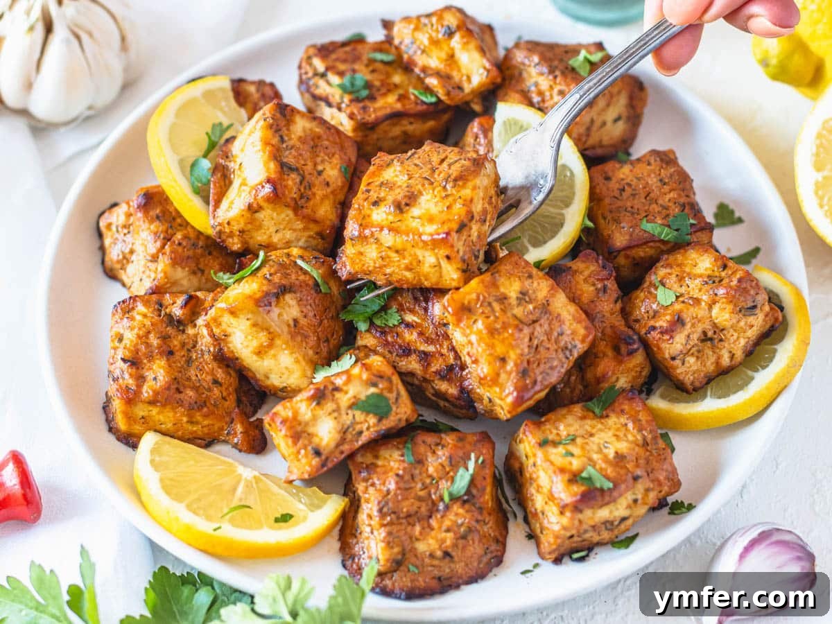 Healthy Asian Kitchen 6 Marinated tofu on a white plate with lemon