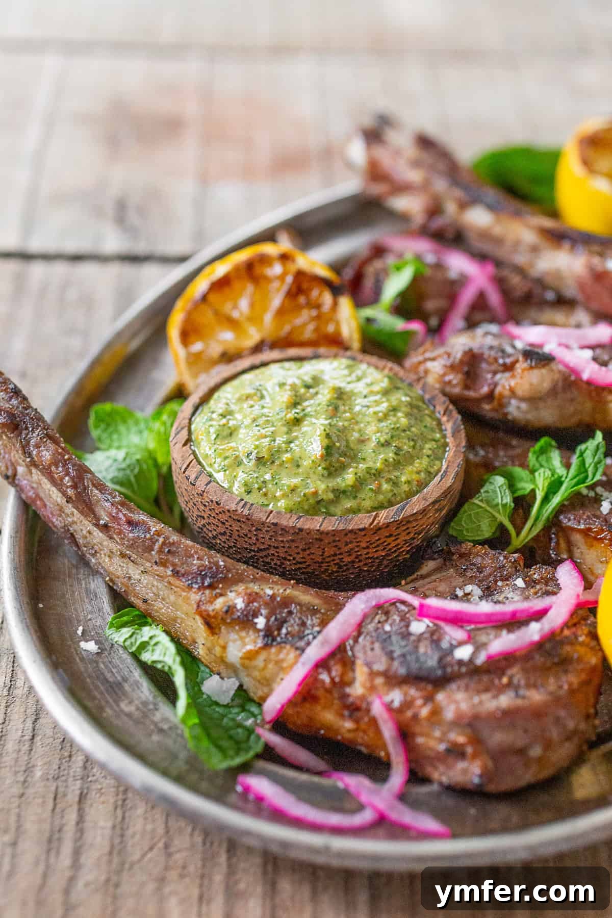 Grilled Lamb Chops with Emerald Pistachio Mint Pesto 3 Grilled Lamb Chops with Pistachio Mint Pesto served with extra pesto.