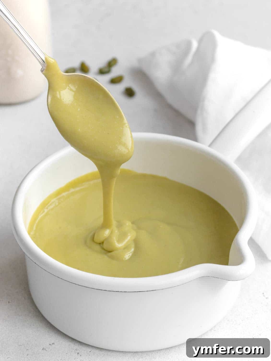 Velvet Pistachio Crème 2 Vibrantly green pistachio custard in a glass bowl, showcasing its creamy texture, ready to be served or used in other desserts.