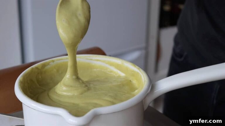 Velvet Pistachio Crème 10 Pistachio custard step 4: Cooking and stirring the custard mixture until it thickens.
