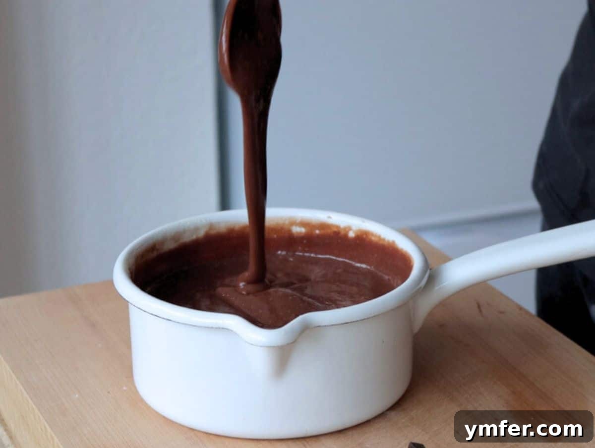 Decadent Chocolate Custard 7 Smooth and glossy chocolate custard in a small white pot, ready for cooling.