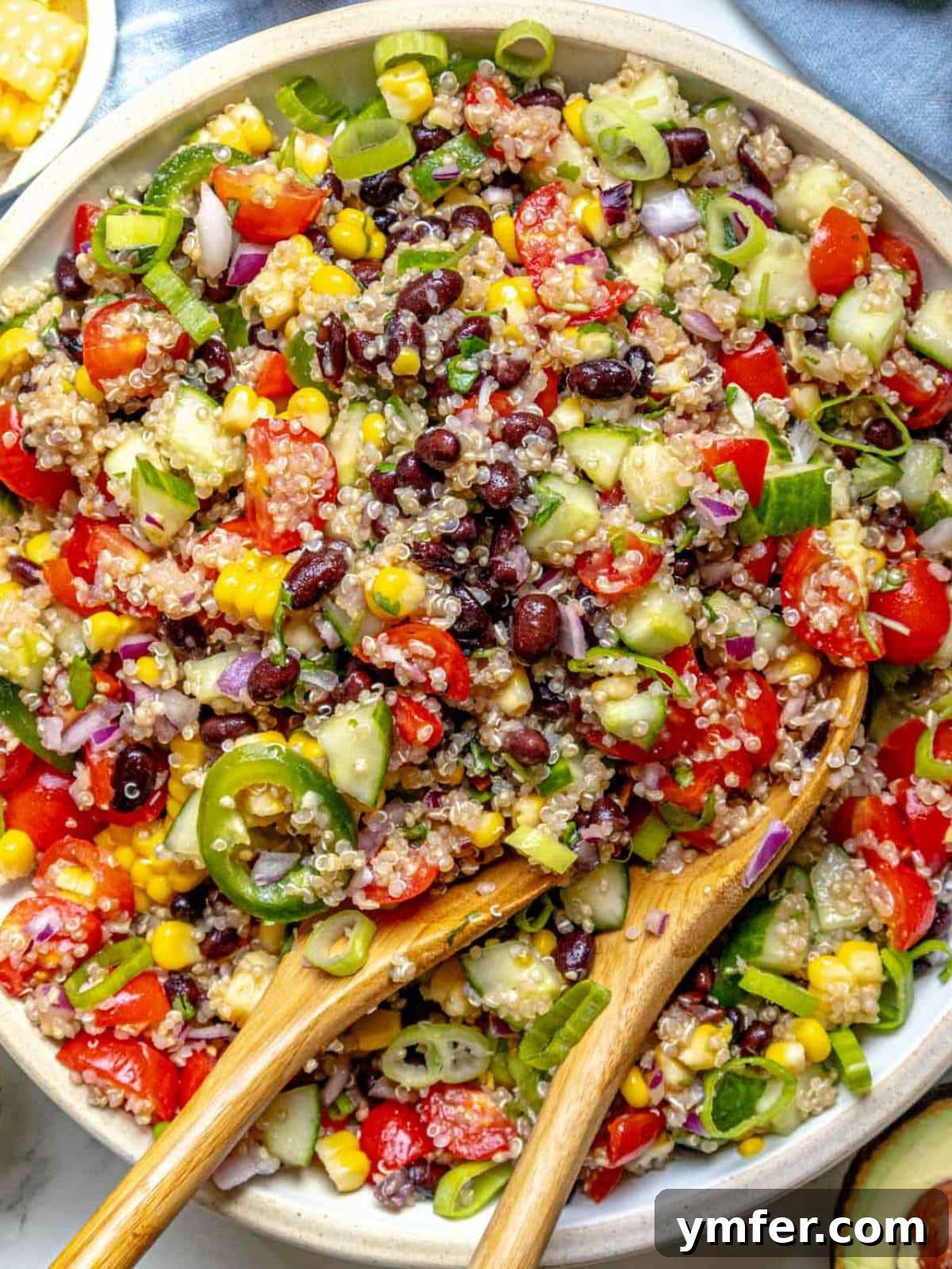 Vibrant Quinoa Bowl 2 Mexican quinoa salad with black beans, corn, and cherry tomatoes in a large serving bowl.