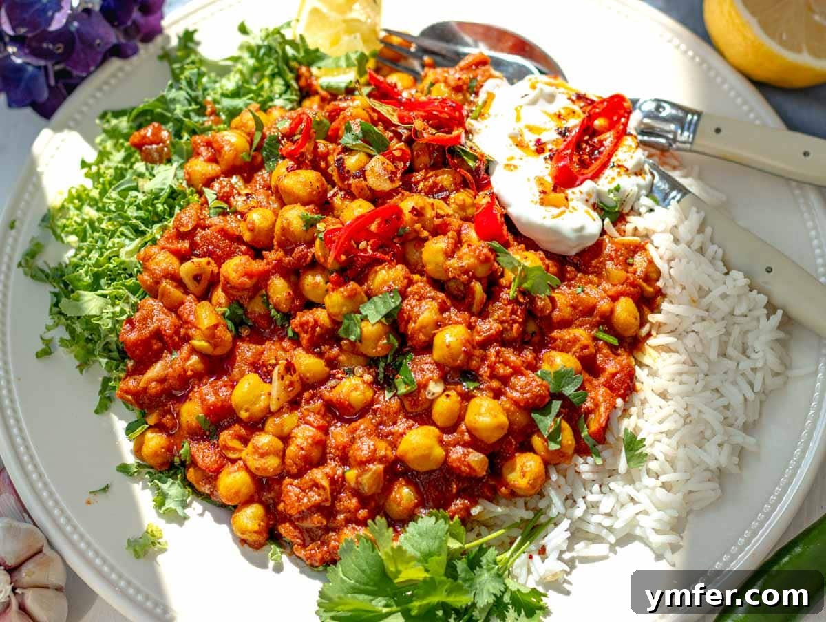 30 Dutch Oven Feasts 14 Chana masala with rice and kale on a plate