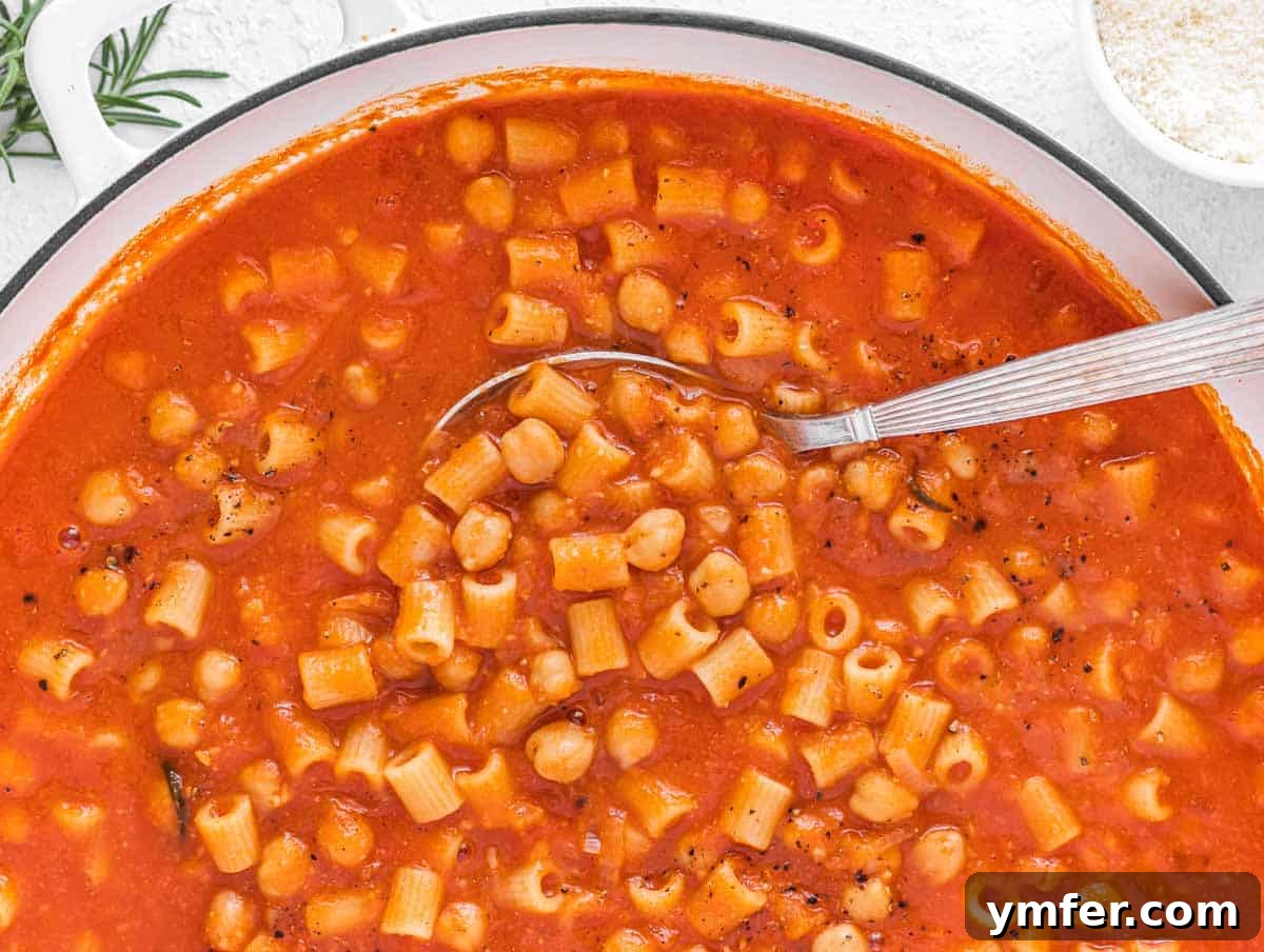 30 Dutch Oven Feasts 20 pasta a ceci with silver spoon