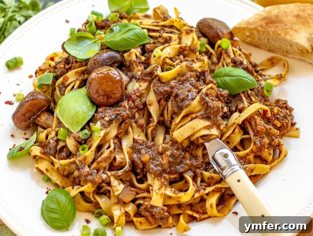 30 Dutch Oven Feasts 24 mushroom bolognese with fresh basil and a fork