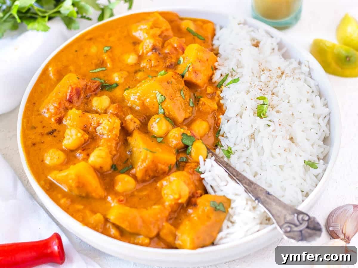 30 Dutch Oven Feasts 4 Pumpkin curry with rice, spoon and fresh parsley