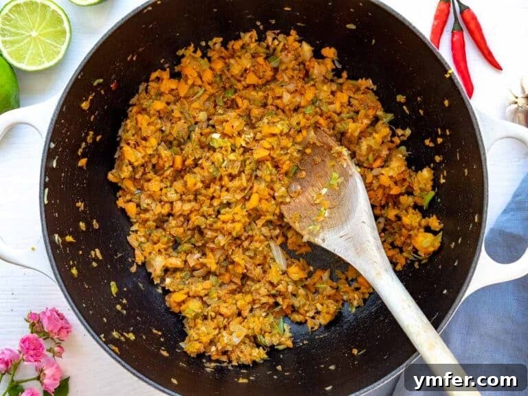 30 Dutch Oven Feasts 35 Step 1: flavor base with onion, carrot, celery, garlic, and cumin
