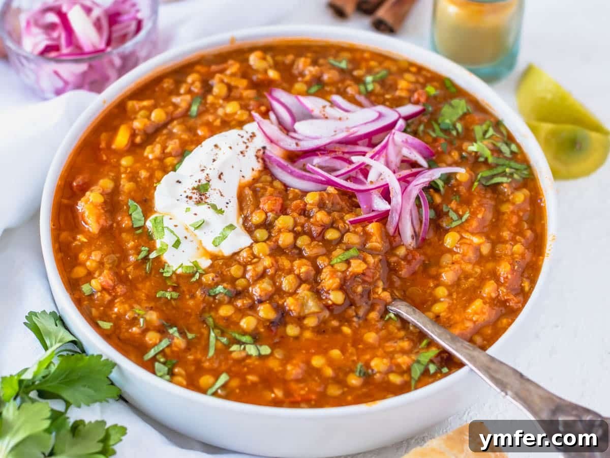 30 Dutch Oven Feasts 8 Moroccan lentil soup with a silver spoon and pickled red onions