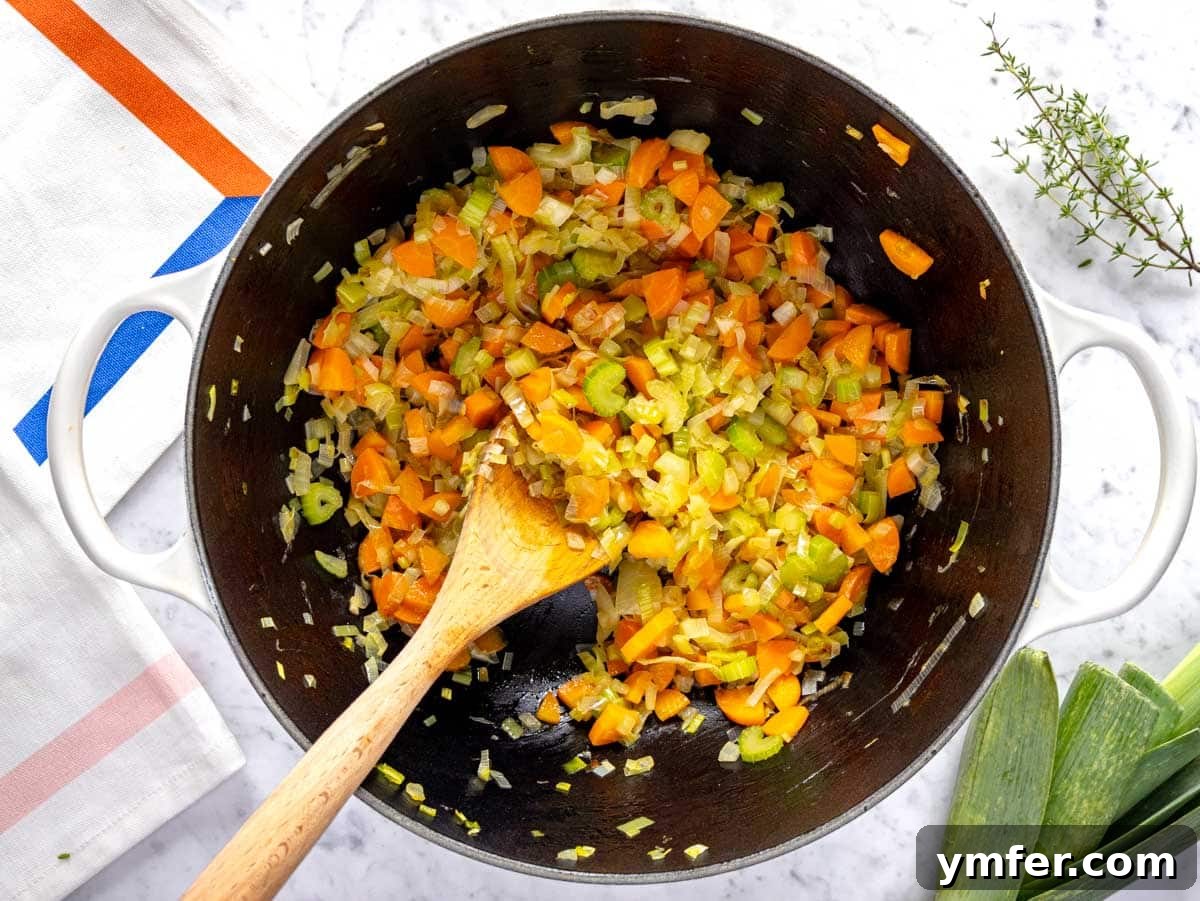 Hearty Cabbage Soup 6 Flavor base with onion, carrot, leek and celery in a large pot