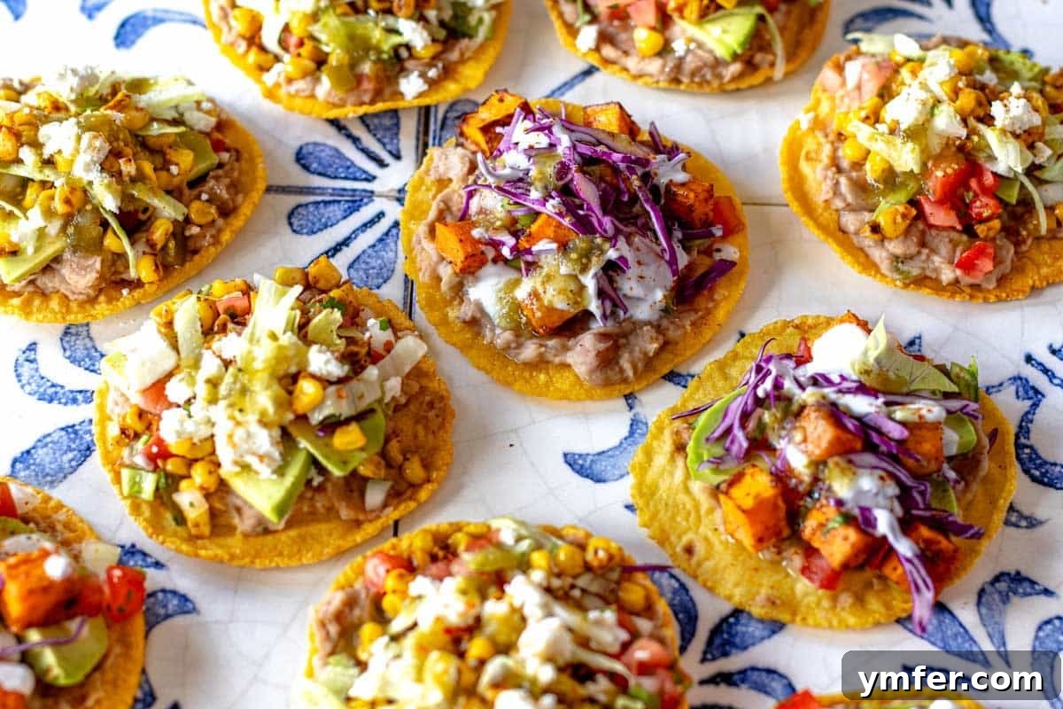 Savory Bean Mash 4 Tostada topped with refried beans, fresh vegetables, and cheese, ready to eat