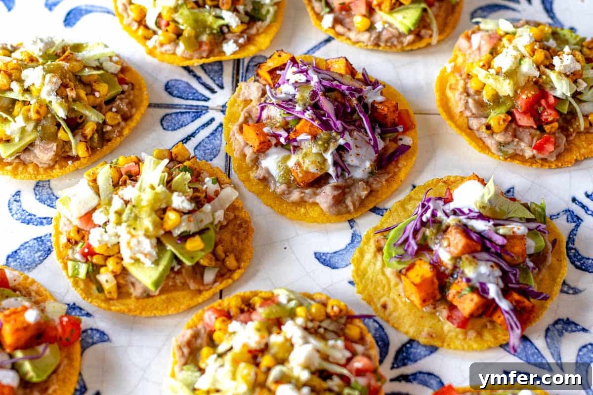 Crispy Topped Tortilla Delights 4 An appetizing display of various tostadas, illustrating diverse topping combinations and vibrant fresh ingredients.