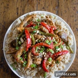 This spicy garlic pork stir fry is the perfect weeknight takeout fakeout! Why order random stir fry when you can make your own super flavorful dish at home? Plus it's ready in just 35 minutes! This stir fry is slightly spicy, full of garlic flavor and packed with marinated pork, mushrooms, red bell pepper and crispy steamed green beans.