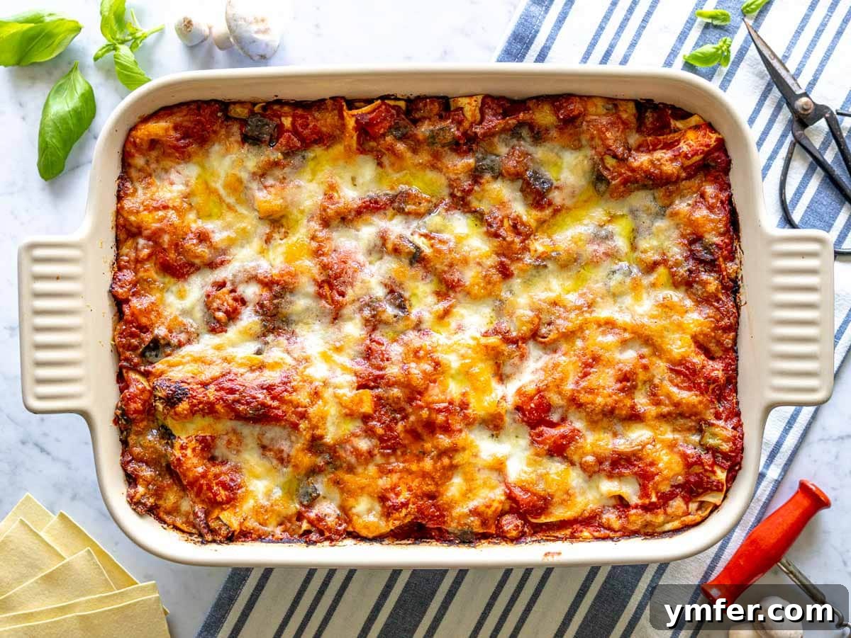 Garden Lasagna 11 A freshly baked vegetable lasagna, boasting a golden-brown, bubbly cheese topping, just removed from the oven.