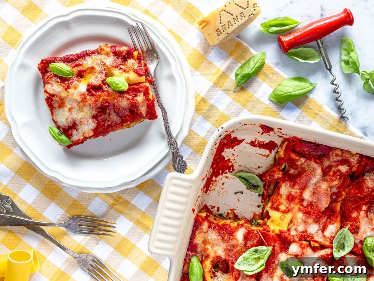 Hearty Stuffed Pasta Bake 11 A serving of spinach and ricotta cannelloni on a plate, garnished with fresh basil, ready to be enjoyed.