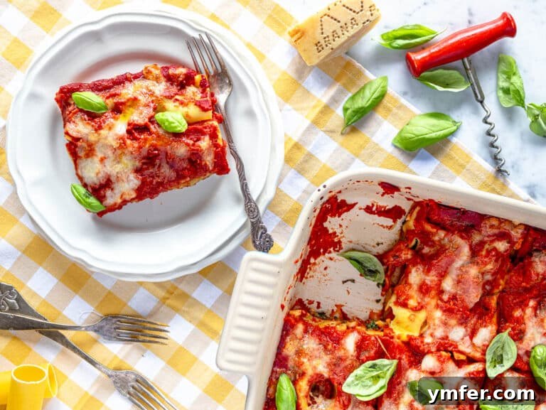 Hearty Stuffed Pasta Bake 19 A plated serving of spinach and ricotta cannelloni, garnished with fresh basil.