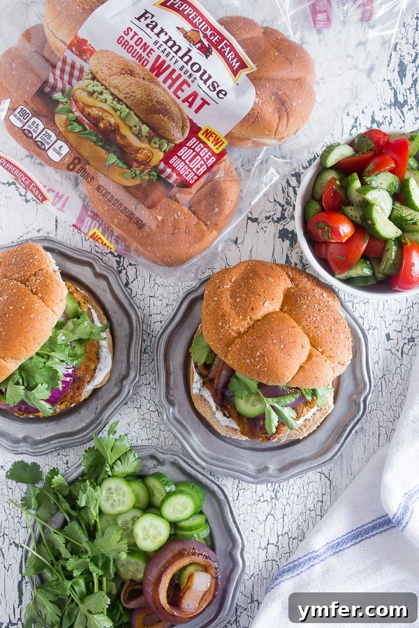 The Tandoori Flame Burger 3 This chicken tandoori burger is packed full of spices and fresh chopped herbs. Piled high with fresh cilantro, cucumber, grilled onions and Greek yogurt sauce. This burger is perfect for all your summer BBQ parties!