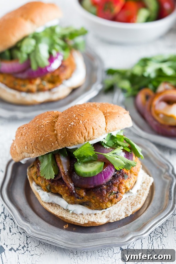 The Tandoori Flame Burger 4 This chicken tandoori burger is packed full of spices and fresh chopped herbs. Piled high with fresh cilantro, cucumber, grilled onions and Greek yogurt sauce. This burger is perfect for all your summer BBQ parties!