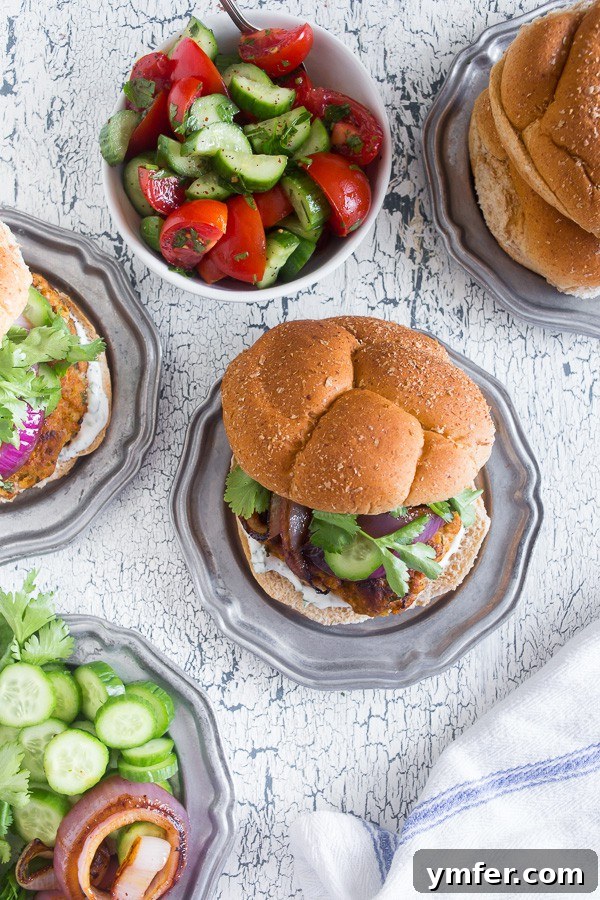 The Tandoori Flame Burger 5 This chicken tandoori burger is packed full of spices and fresh chopped herbs. Piled high with fresh cilantro, cucumber, grilled onions and Greek yogurt sauce. This burger is perfect for all your summer BBQ parties!