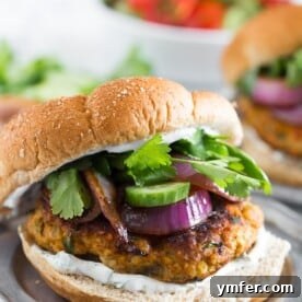 The Tandoori Flame Burger 6 This chicken tandoori burger is packed full of spices and fresh chopped herbs. Piled high with fresh cilantro, cucumber, grilled onions and Greek yogurt sauce. This burger is perfect for all your summer BBQ parties!