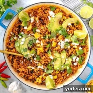 Mexican rice with avocado and cilantro in a skillet, ready to eat
