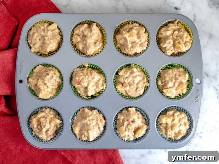 Orchard Spice Muffins 13 Muffin batter into the muffin tin.