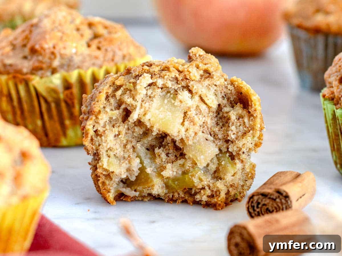 Orchard Spice Muffins 4 Apple muffin cut in half where you can see the apple filling.