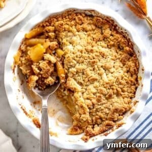 apple crumble with a silver spoon