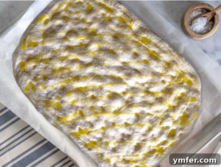 Golden Olive Oil Flatbread 22 Schiacciata on a baking tray before baking