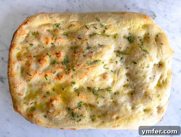 Golden Olive Oil Flatbread 23 Schiacciata after baking on a marble surface