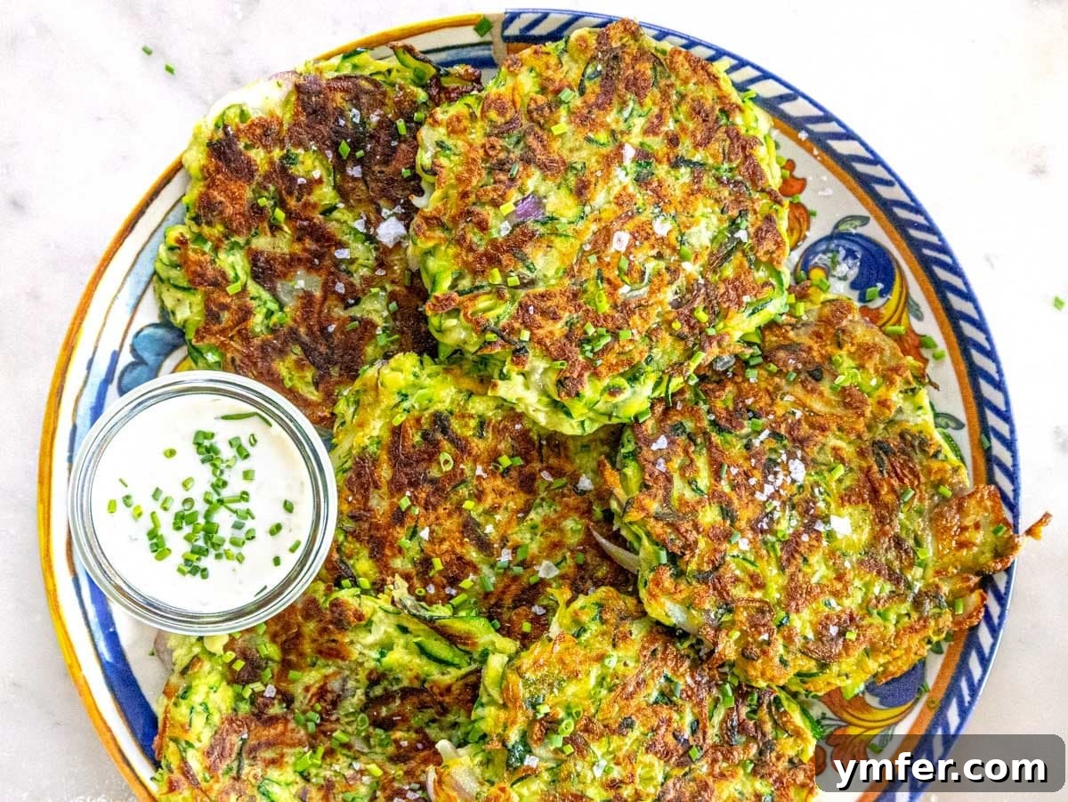 Fuel Your Morning: 30 Plant-Powered Breakfast Creations 13 Zucchini fritters after cooking with yogurt sauce