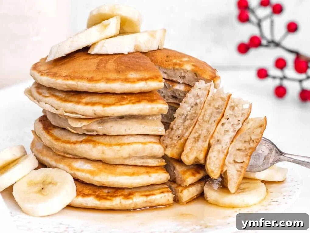 Fuel Your Morning: 30 Plant-Powered Breakfast Creations 21 cut open banana pancakes with maple syrup