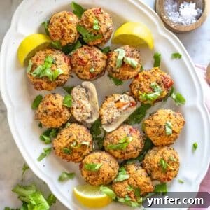 stuffed mushrooms with ricotta on a white serving plate