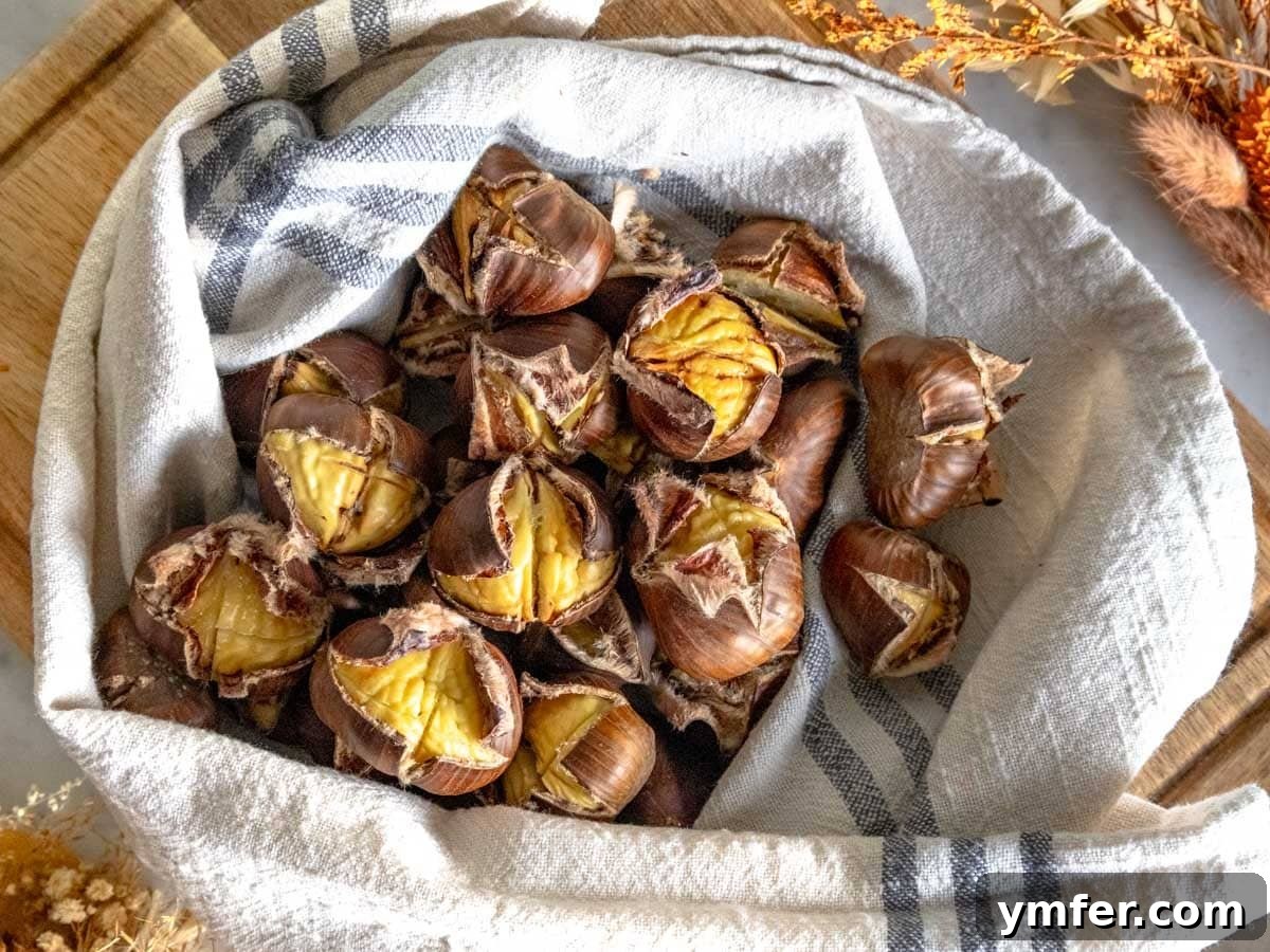 Fireside Roasted Chestnuts 3 Roasted chestnuts wrapped in a cloth, ready for enjoyment.