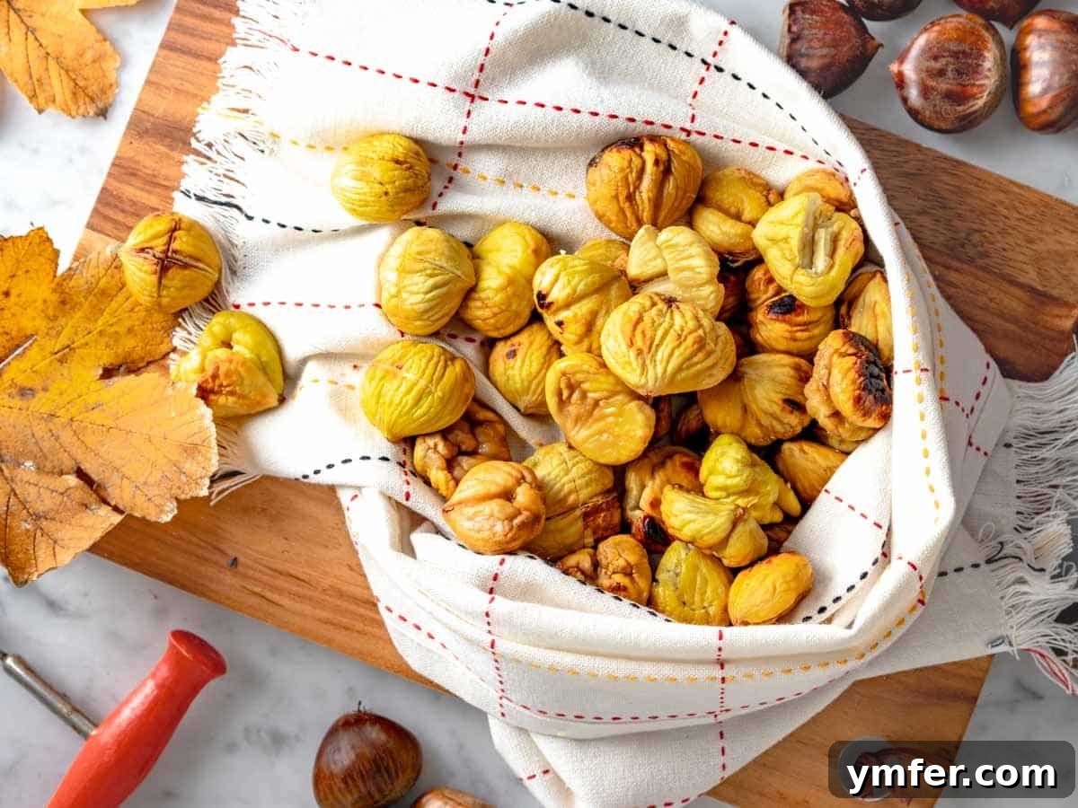 Fireside Roasted Chestnuts 4 Roasted chestnuts cooked in the air fryer and wrapped in a kitchen cloth.