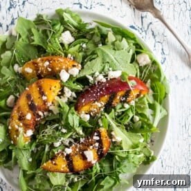 This grilled nectarine salad combines two of my favorite summer things - salads and grilling! Sweet nectarines lightly grilled and tossed into a bed of arugula, ricotta salata and drizzled with a light honey balsamic dressing. You'll love how much flavor is packed into this beauty!