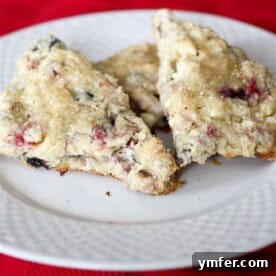 Berry Bliss White Chocolate Scones 4 mixed berry white chocolate scones on a plate