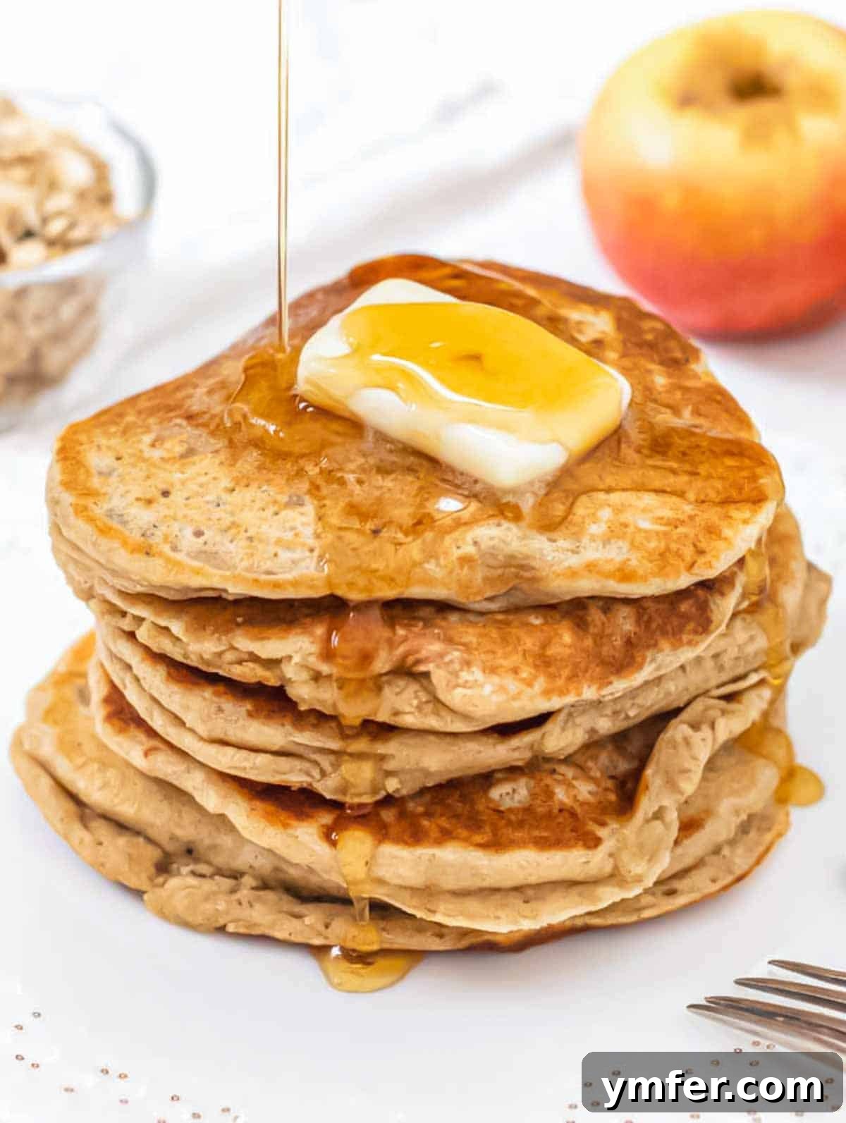 Hearty Oat Flapjacks 2 Stack of freshly made oatmeal pancakes, drizzled with maple syrup.