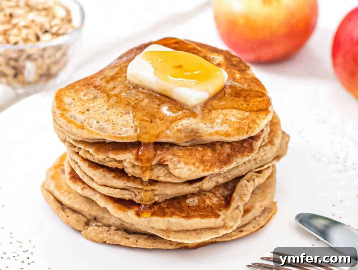 Hearty Oat Flapjacks 6 Stack of oatmeal pancakes with vegan butter.