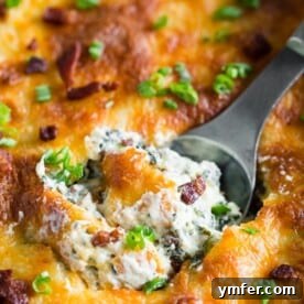 This baked spinach bacon dip is the perfect party snack. Packed full of spinach, crispy bacon, cream cheese, sharp cheddar cheese and green onions. This dip is so easy you'll want to make it every single weekend! PLUS it's ready in just 30 minutes!