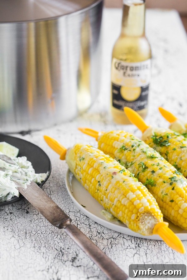 Bira Buharında Mısır Keyfi 4 Beer Steamed Corn on the Cob on a plate with corn holders. Ready to eat and enjoy.